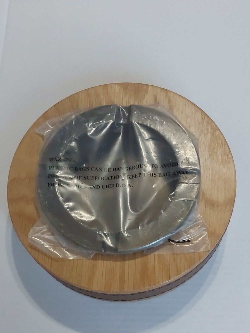 Round Wooden Tray Holding Metal AshTray.